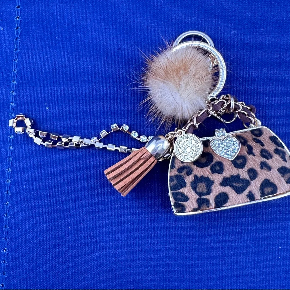 Unbranded keychain or purse charm. White, tan and black. NEW